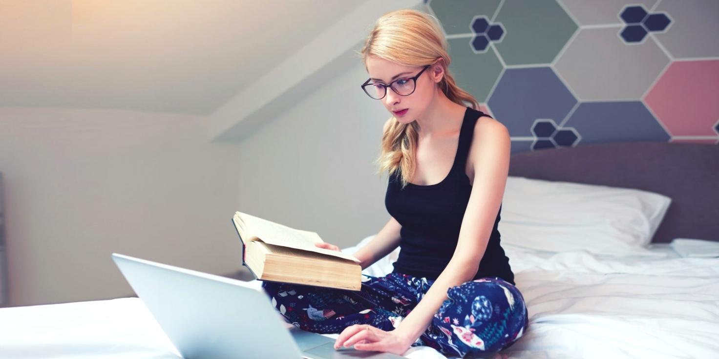 Business owner organizing financial documents and reviewing spreadsheets at desk