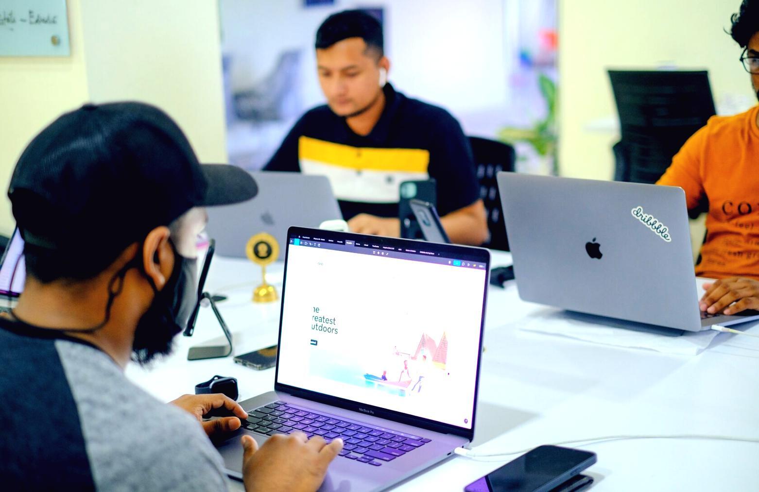 Financial planning workspace with calculator and business reports spread on table